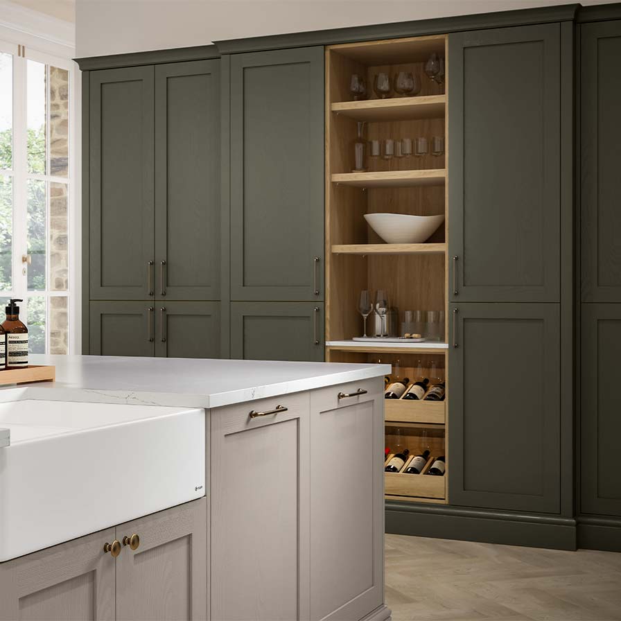 Green shaker kitchen with oak open shelving