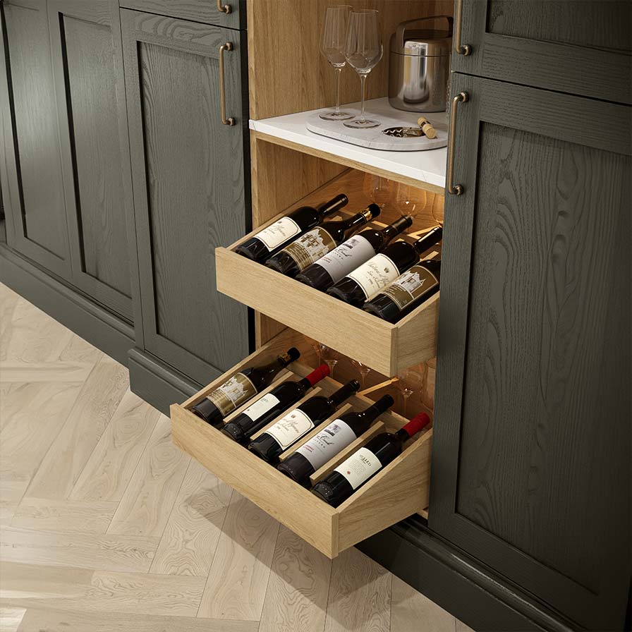 Green shaker kitchen with oak wine drawers