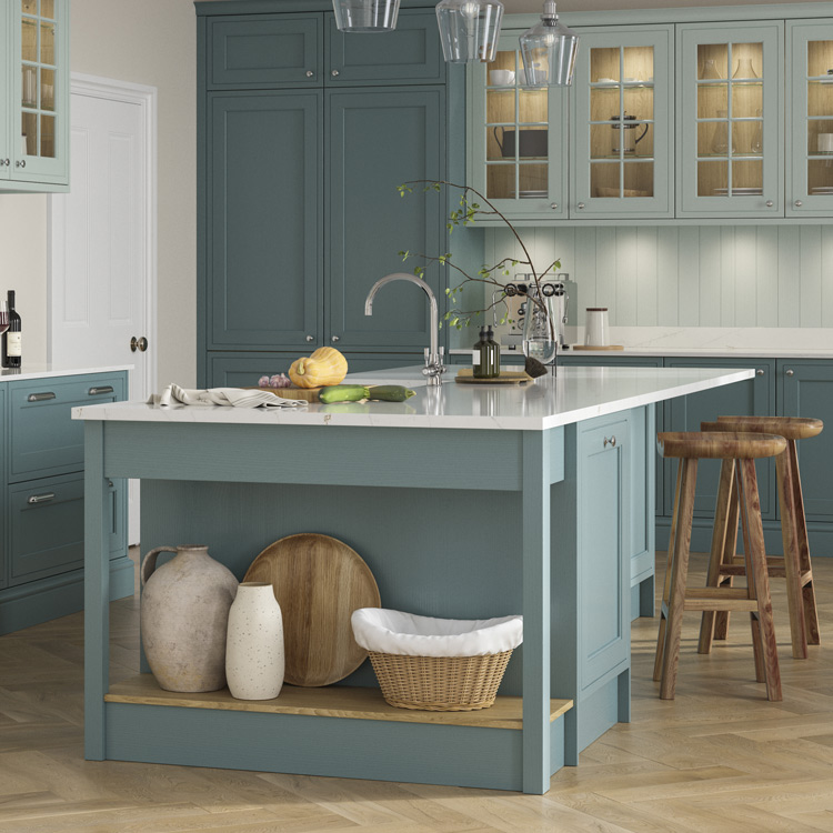 A chef’s table attached to a kitchen island with bar stools