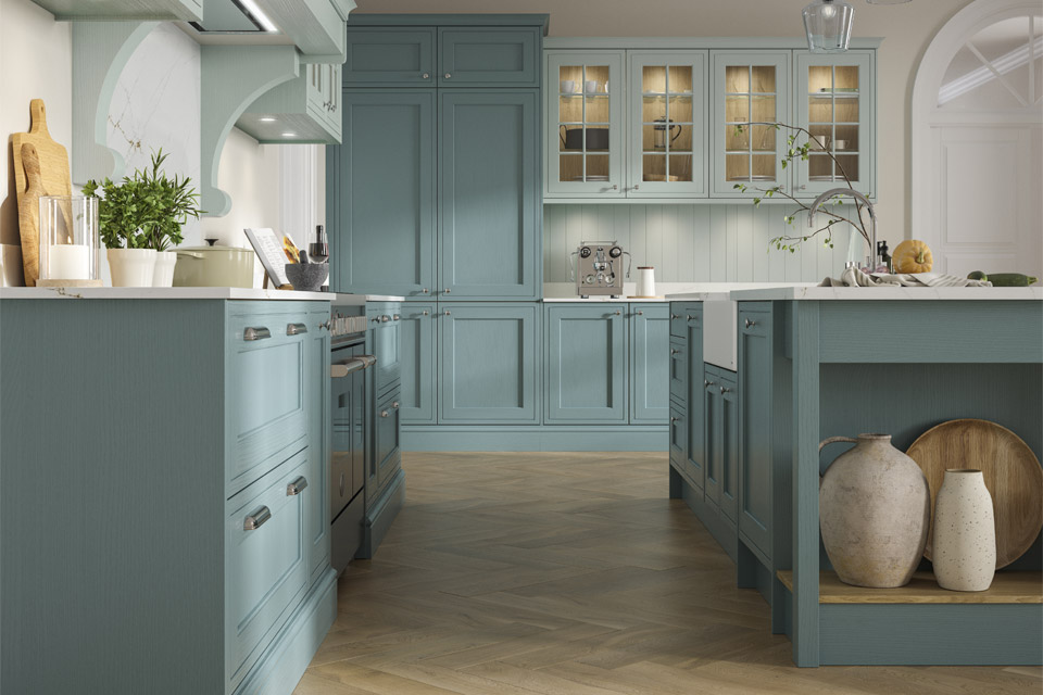 A classic kitchen with blue kitchen doors and a white kitchen sink