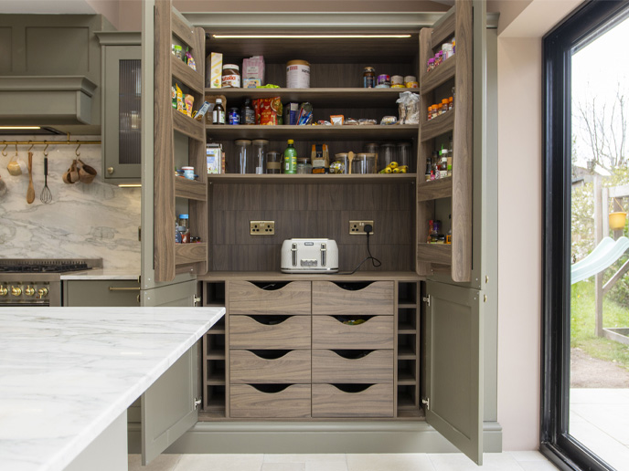 A butler’s pantry in a dark wood kitchen