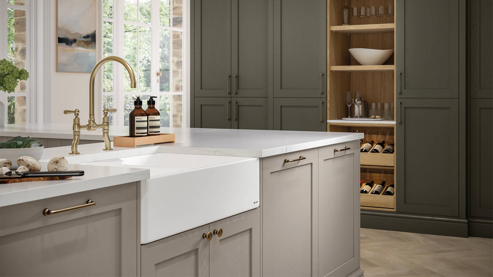 A Shaker-style kitchen with modern sage green kitchen cabinets and cream Shaker kitchen elements
