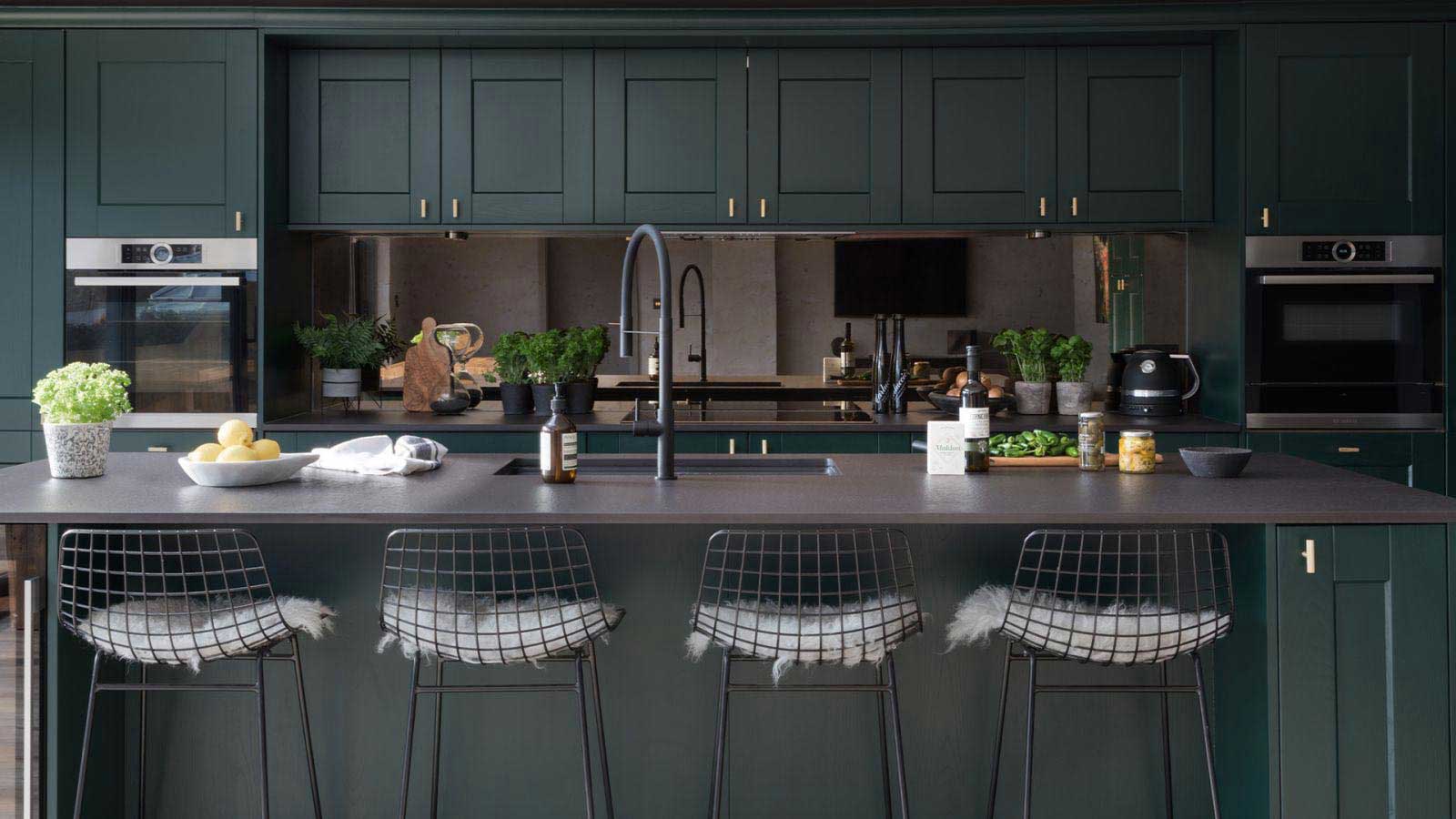 Dark green kitchen with large island