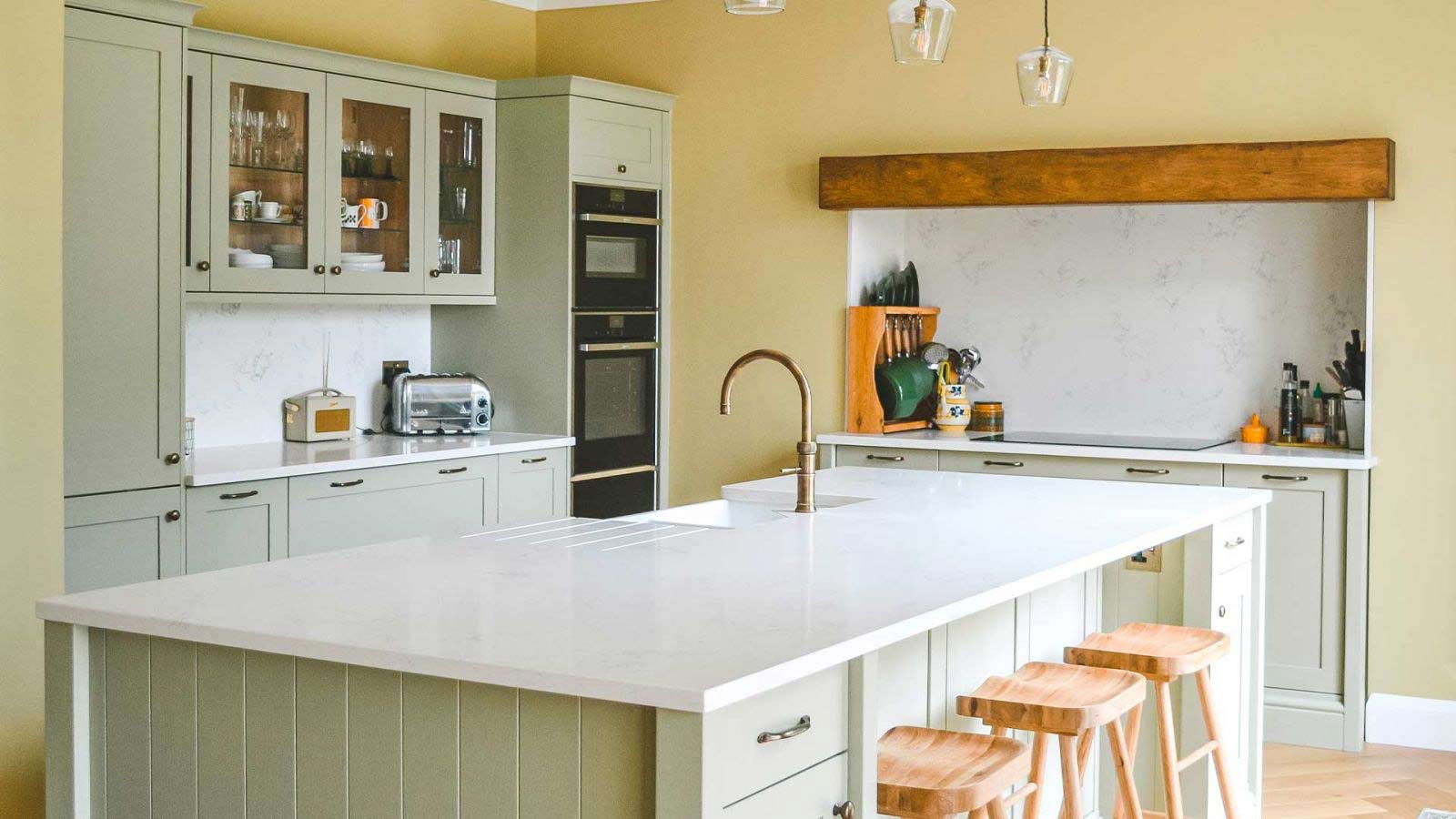 Traditional sage green kitchen with island