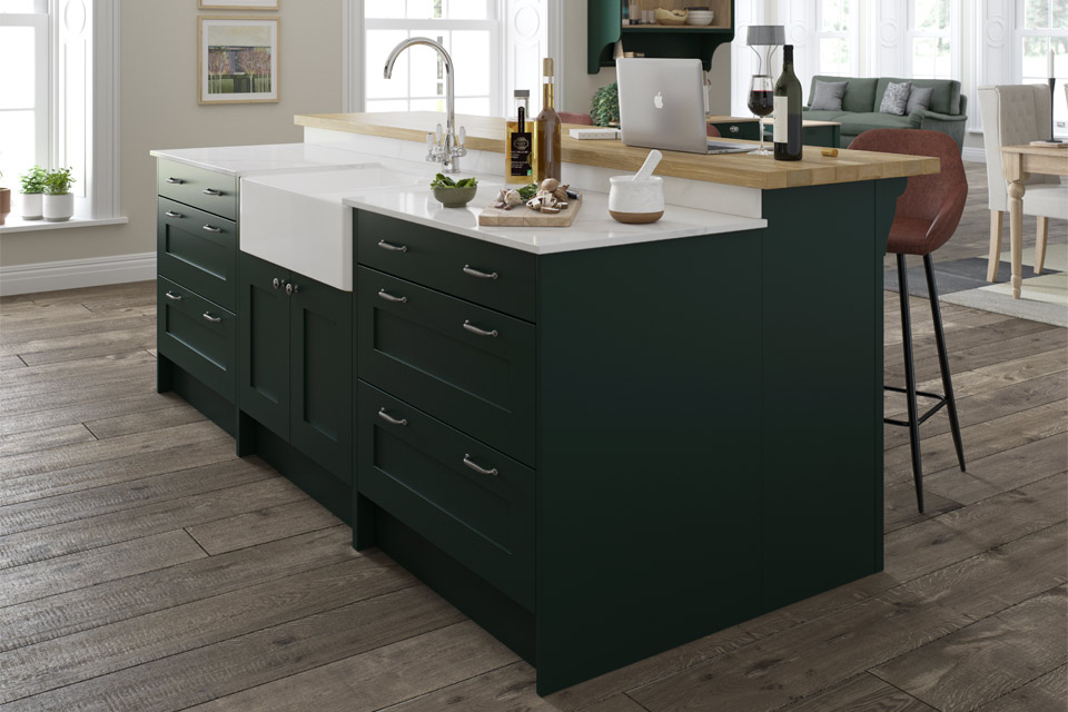 A hunter green kitchen with Shaker kitchen doors