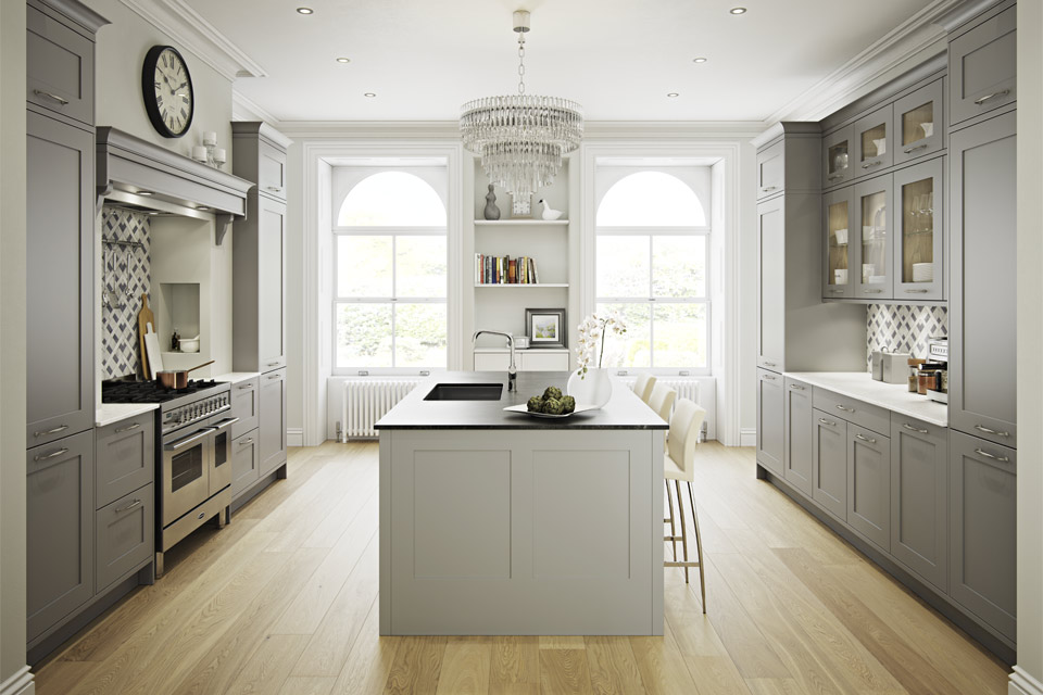 A grey kitchen with white worktops and a dark kitchen island