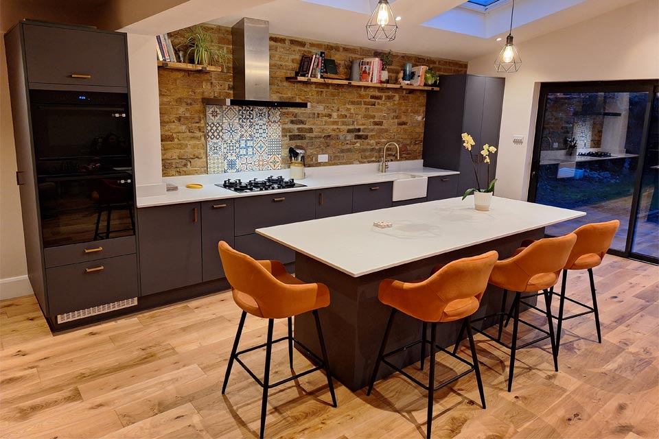 A modern urban kitchen with an industrial kitchen light worktop