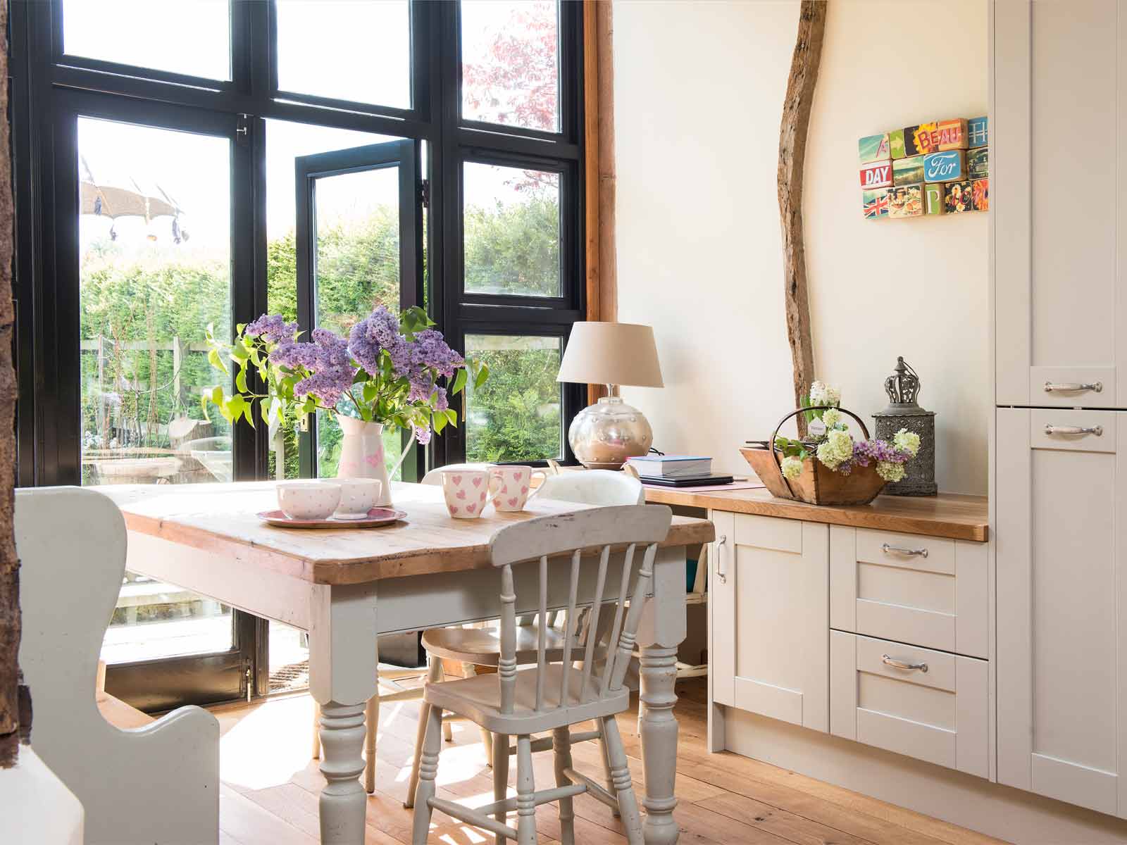 A Nancy-Meyers-style kitchen with a utensils exhibiting a transformational style