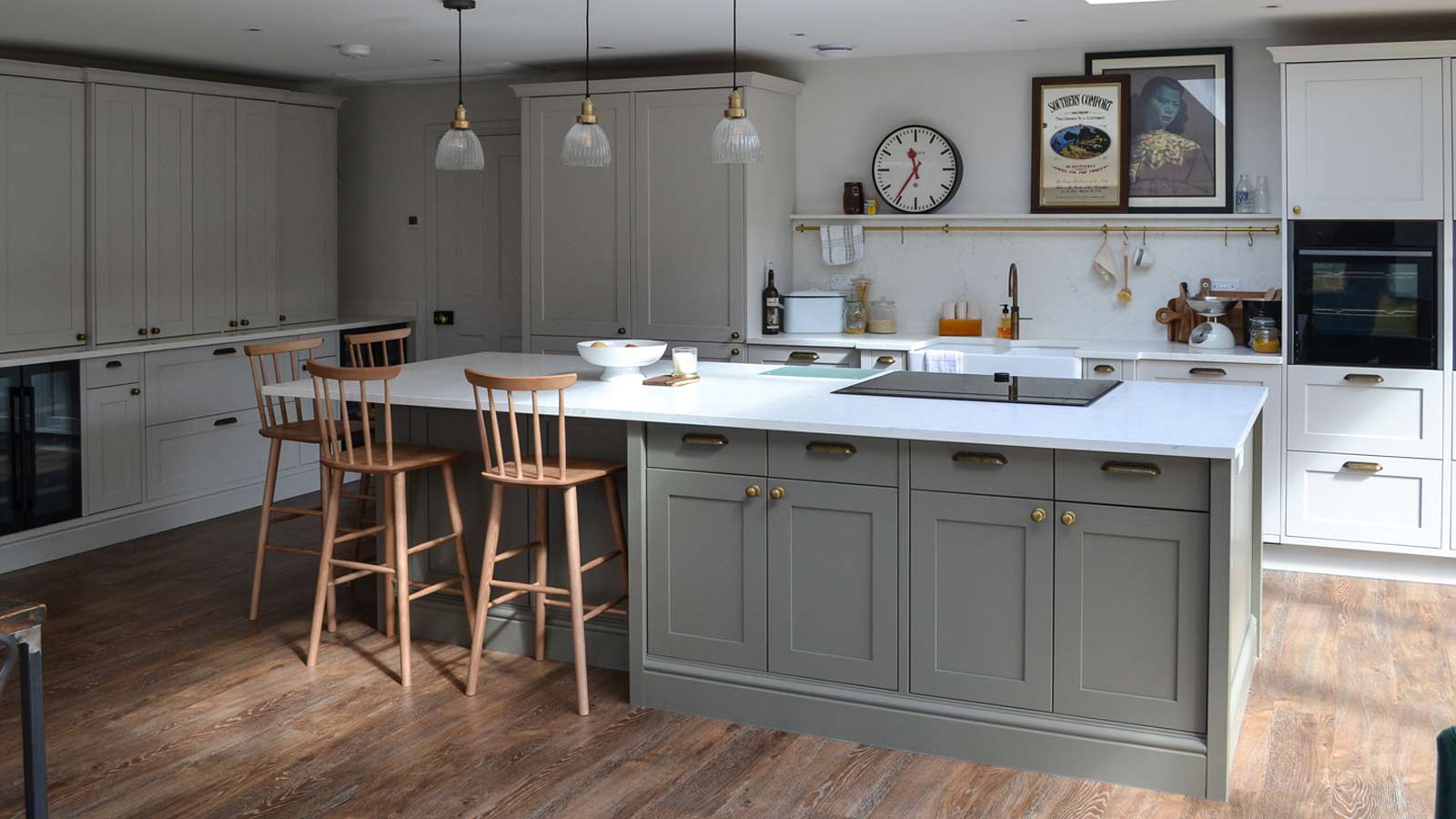 A Nancy-Meyers-style kitchen with marble worktops and soapstone countertops