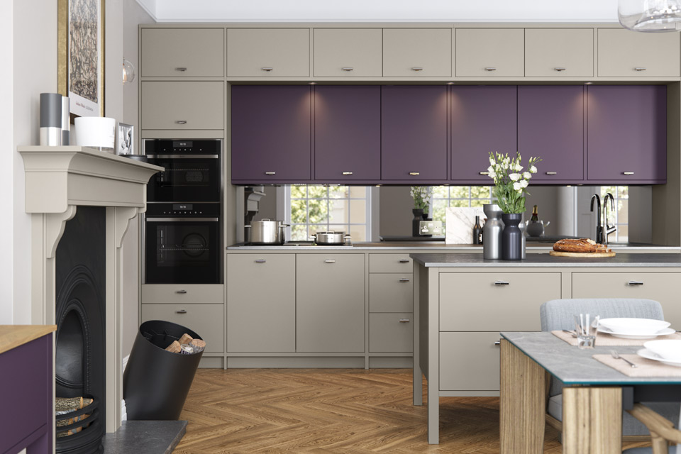 A modern purple kitchen with flat slab doors and task lighting