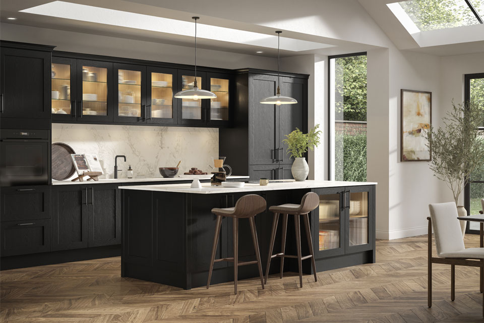 A black Scandi kitchen with Nordic-style chairs